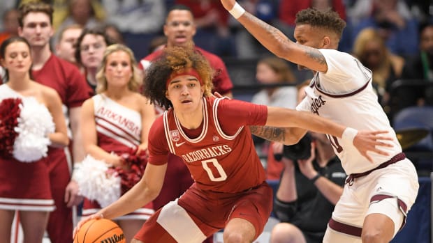 Mar 10, 2023; Nashville, TN, USA; Arkansas Razorbacks guard Anthony Black (0) dribbles the ball while defended by Texas A&M Aggies guard Dexter Dennis (0) during the second half at Bridgestone Arena. Mandatory Credit: Steve Roberts-USA TODAY Sports